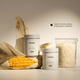 Two Versi skincare jars arranged with a corn cob, and a glass container of rice grains on a warm beige background. Text on the right reads 'Clean formula without unnecessary additives'.