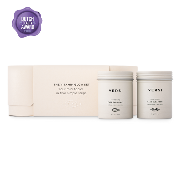 Versi Vitamin Glow Set facial care set including a beige-colored box, a face exfoliant, and a face cleanser, displayed on a clean white background with a purple Dutch Beauty Award badge in the top left corner.